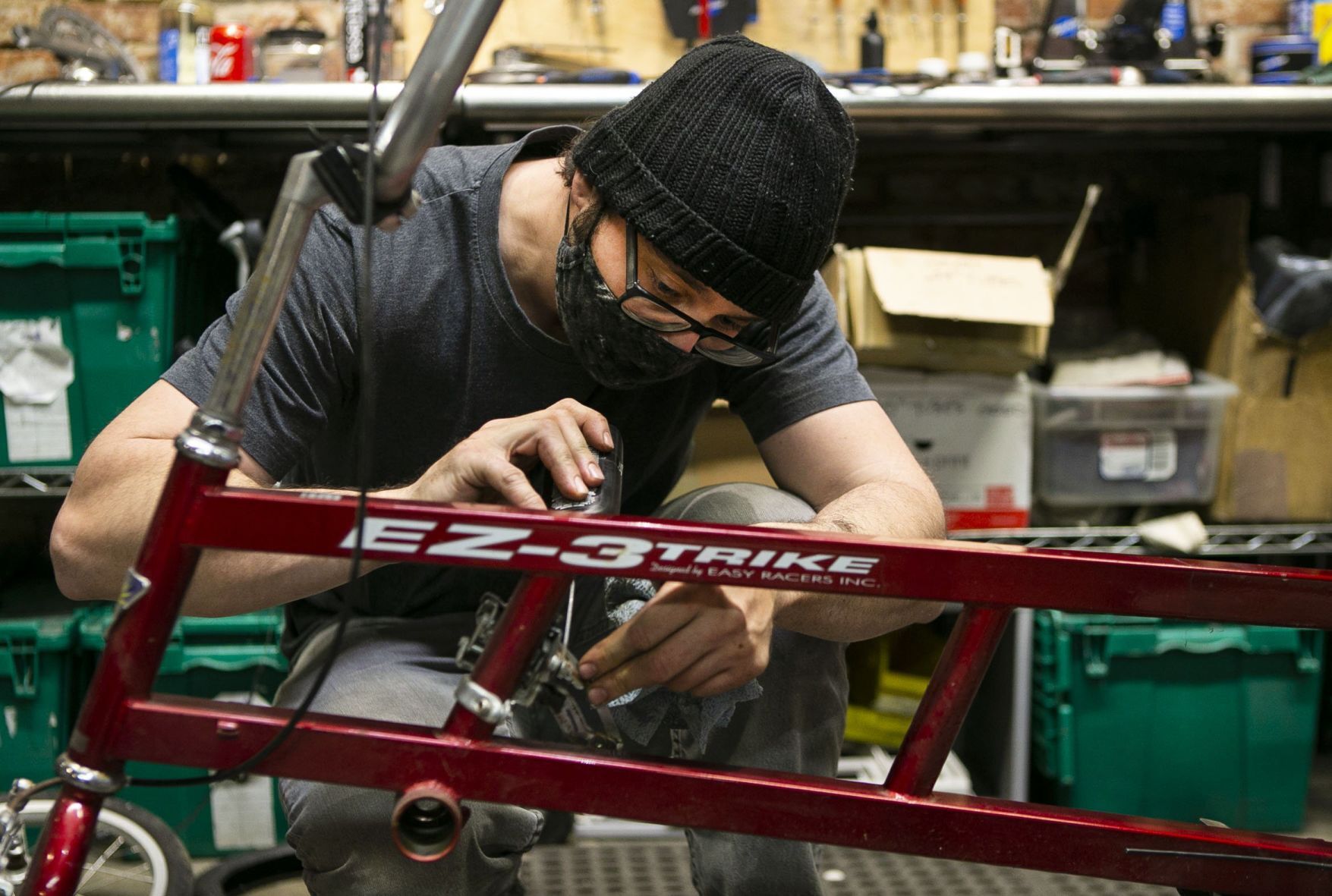 Volunteers and employees repair bikes at St. Louis BWorks in Soulard